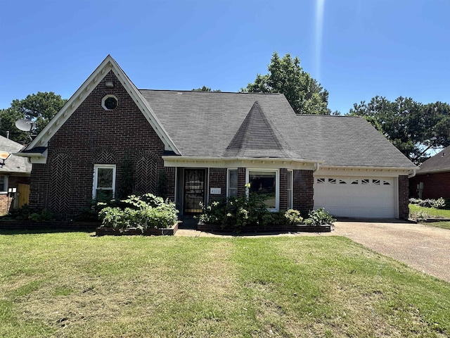 4378 Donnegan Cv, Memphis, TN 38125 - view of front of property featuring brick siding, an attached garage, a front yard, concrete driveway, and a shingled roof