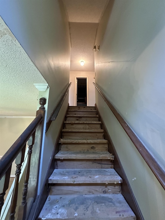 4378 Donnegan Cv, Memphis, TN 38125 - staircase with a textured ceiling