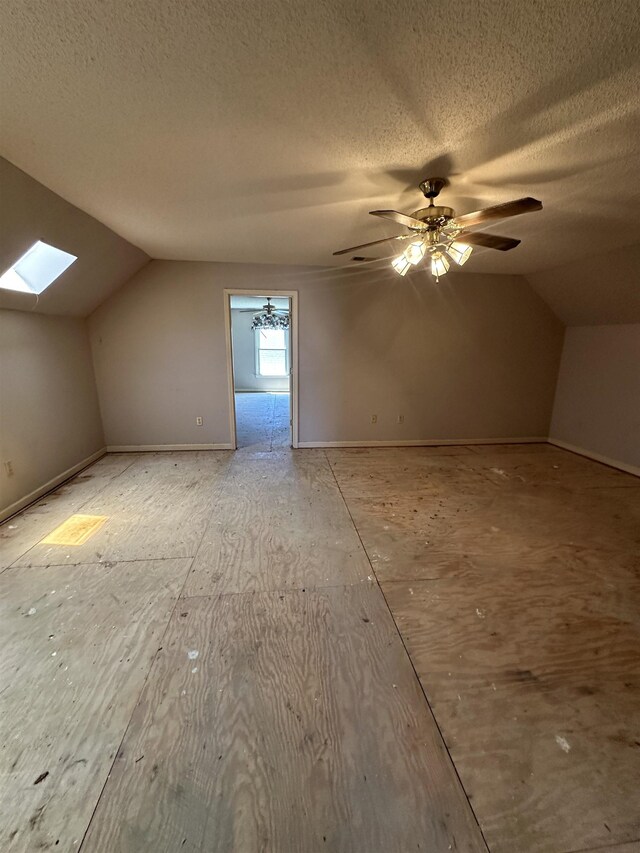 4378 Donnegan Cv, Memphis, TN 38125 - additional living space featuring lofted ceiling, a skylight, a ceiling fan, and a textured ceiling