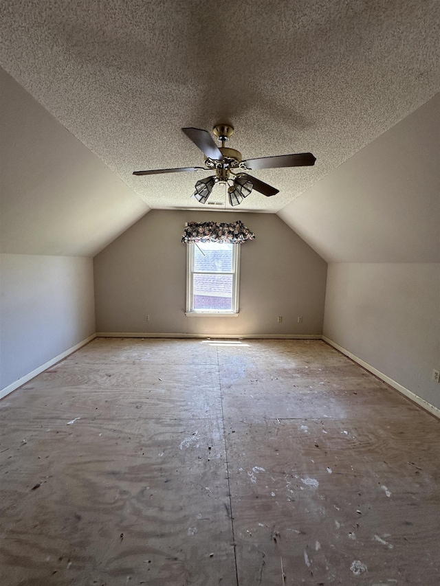 4378 Donnegan Cv, Memphis, TN 38125 - additional living space with ceiling fan, lofted ceiling, baseboards, and a textured ceiling