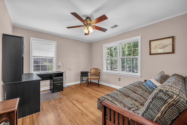 630 Raleigh-Lagrange Dr, Rossville, TN 38066 - living area with crown molding, ceiling fan, light wood-type flooring, baseboards, and a desk