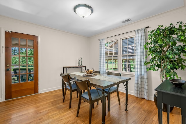 630 Raleigh-Lagrange Dr, Rossville, TN 38066 - dining area with crown molding, light wood finished floors, and baseboards