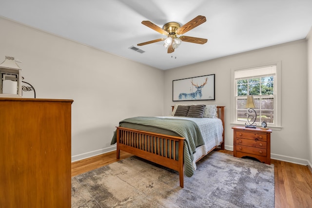 630 Raleigh-Lagrange Dr, Rossville, TN 38066 - bedroom featuring baseboards, wood finished floors, and ceiling fan
