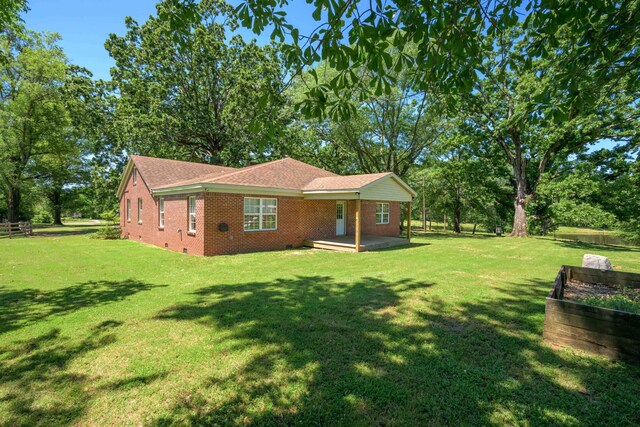 630 Raleigh-Lagrange Dr, Rossville, TN 38066 - view of front facade with brick siding, a front yard, crawl space, and a shingled roof