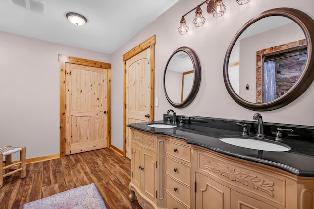630 Raleigh-Lagrange Dr, Rossville, TN 38066 - bathroom featuring double vanity, wood finished floors, and baseboards
