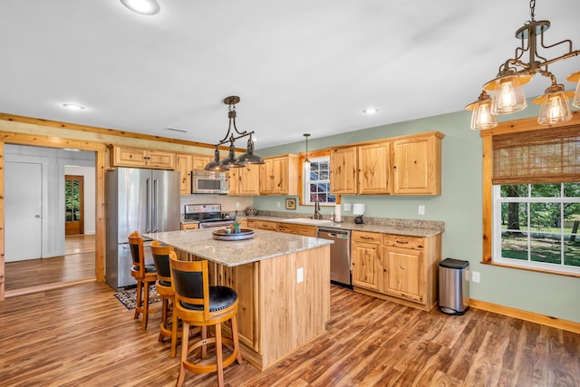 630 Raleigh-Lagrange Dr, Rossville, TN 38066 - kitchen with stainless steel appliances, light wood-type flooring, a kitchen island, recessed lighting, and a sink