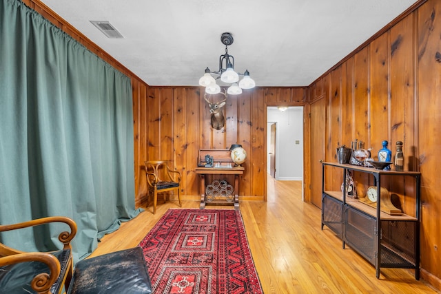 630 Raleigh-Lagrange Dr, Rossville, TN 38066 - dining area featuring a chandelier, wood finished floors, wooden walls, and baseboards