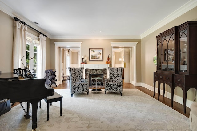 7726 Chapel Creek Pkwy N, Memphis, TN 38016 - living area featuring wood finished floors, ornamental molding, baseboards, and a premium fireplace
