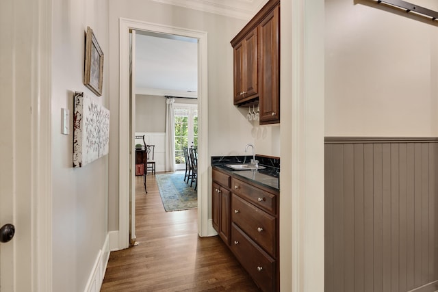 7726 Chapel Creek Pkwy N, Memphis, TN 38016 - hall with a sink, dark wood-style floors, crown molding, and a wainscoted wall