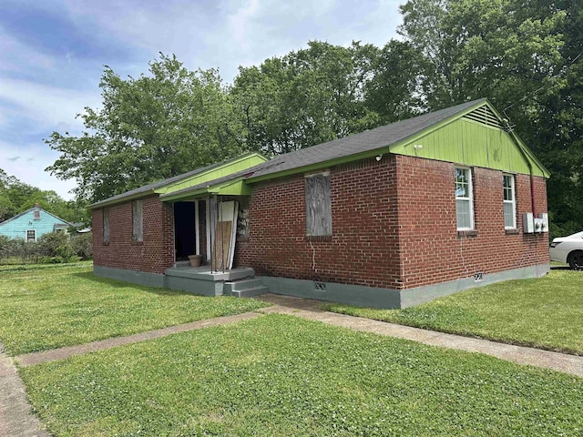 2382 Norman Ave, Memphis, TN 38108 - view of front of home featuring a front yard and brick siding