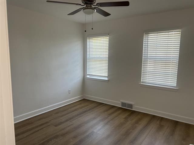 760 E Mckellar Ave, Memphis, TN 38106 - spare room featuring ceiling fan, wood finished floors, and baseboards