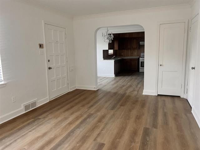 760 E Mckellar Ave, Memphis, TN 38106 - interior space with arched walkways, ornamental molding, wood finished floors, and baseboards