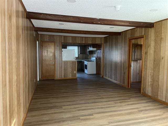 760 E Mckellar Ave, Memphis, TN 38106 - hallway featuring beam ceiling, wood finished floors, wooden walls, baseboards, and a textured ceiling