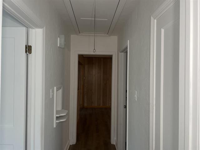760 E Mckellar Ave, Memphis, TN 38106 - corridor featuring attic access and dark wood-type flooring
