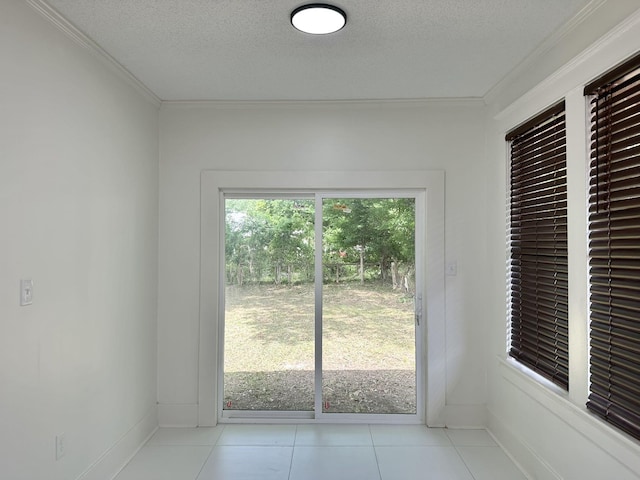 1151 Tanglewood St, Memphis, TN 38114 - entryway with crown molding, a textured ceiling, light tile patterned floors, and baseboards