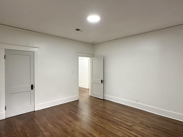 1151 Tanglewood St, Memphis, TN 38114 - empty room with dark wood-style floors and baseboards