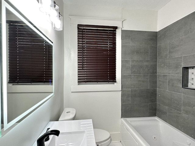 1151 Tanglewood St, Memphis, TN 38114 - bathroom featuring toilet, vanity, and a combined bath / shower with jetted tub