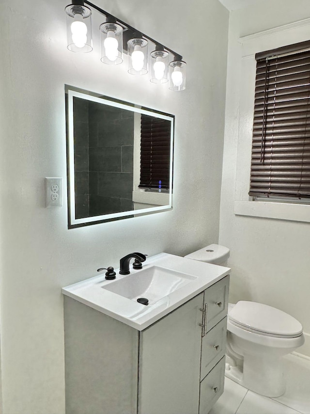 1151 Tanglewood St, Memphis, TN 38114 - half bath featuring vanity, toilet, and tile patterned floors