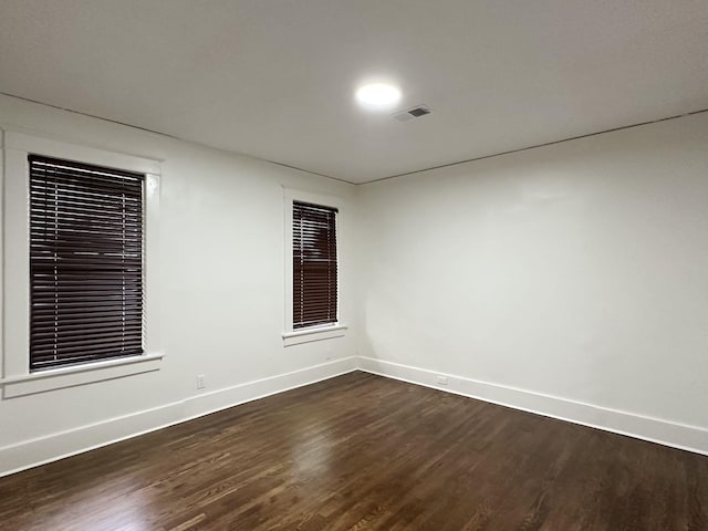1151 Tanglewood St, Memphis, TN 38114 - empty room with baseboards and dark wood-type flooring