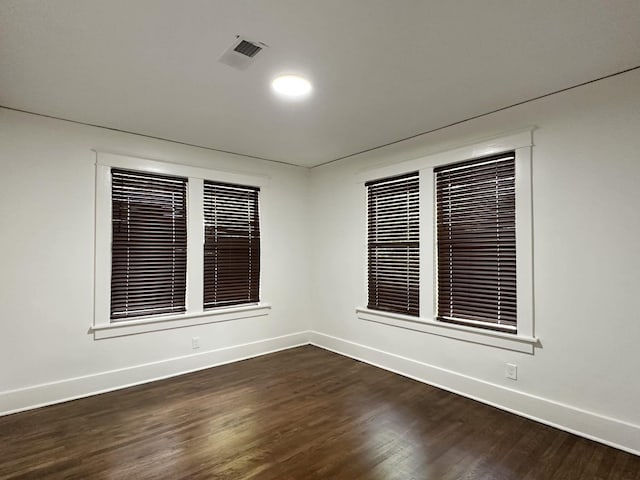 1151 Tanglewood St, Memphis, TN 38114 - spare room featuring baseboards and dark wood-style floors