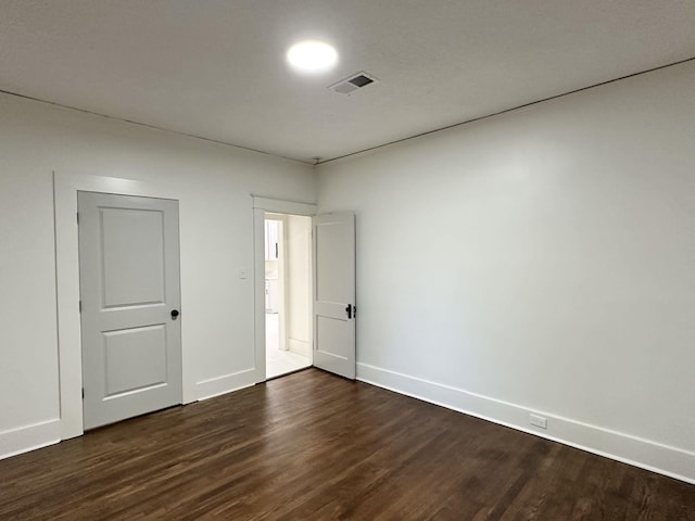 1151 Tanglewood St, Memphis, TN 38114 - unfurnished bedroom with dark wood-style floors and baseboards
