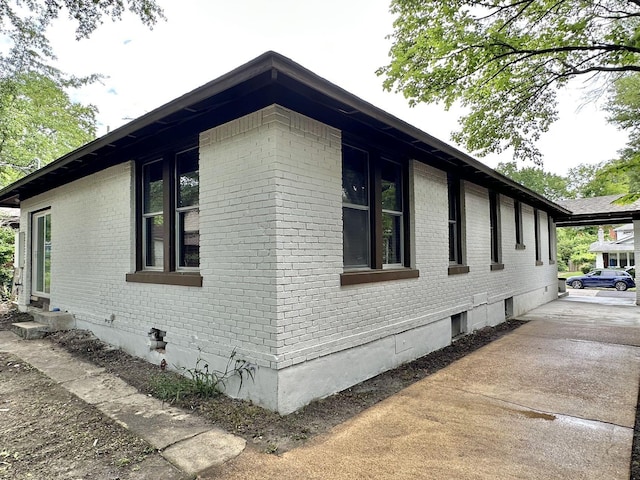 1151 Tanglewood St, Memphis, TN 38114 - view of property exterior with brick siding and crawl space