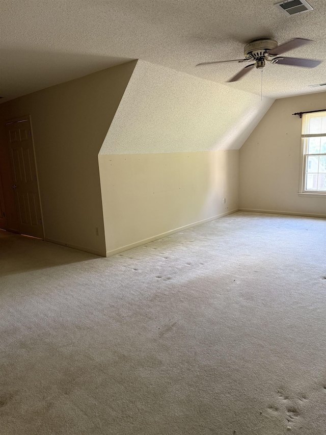 917 Valleyview Ln, Collierville, TN 38017 - additional living space with a textured ceiling, lofted ceiling, ceiling fan, carpet, and baseboards