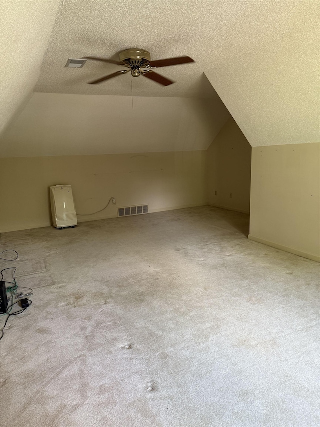 917 Valleyview Ln, Collierville, TN 38017 - additional living space featuring vaulted ceiling, ceiling fan, a textured ceiling, and carpet flooring
