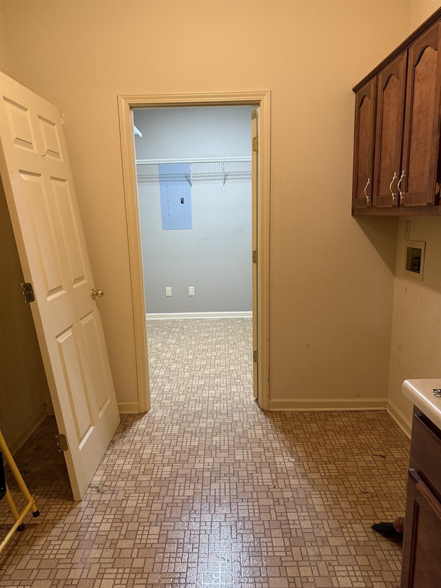 917 Valleyview Ln, Collierville, TN 38017 - laundry room featuring brick patterned floors, cabinet space, electric panel, baseboards, and hookup for a washing machine