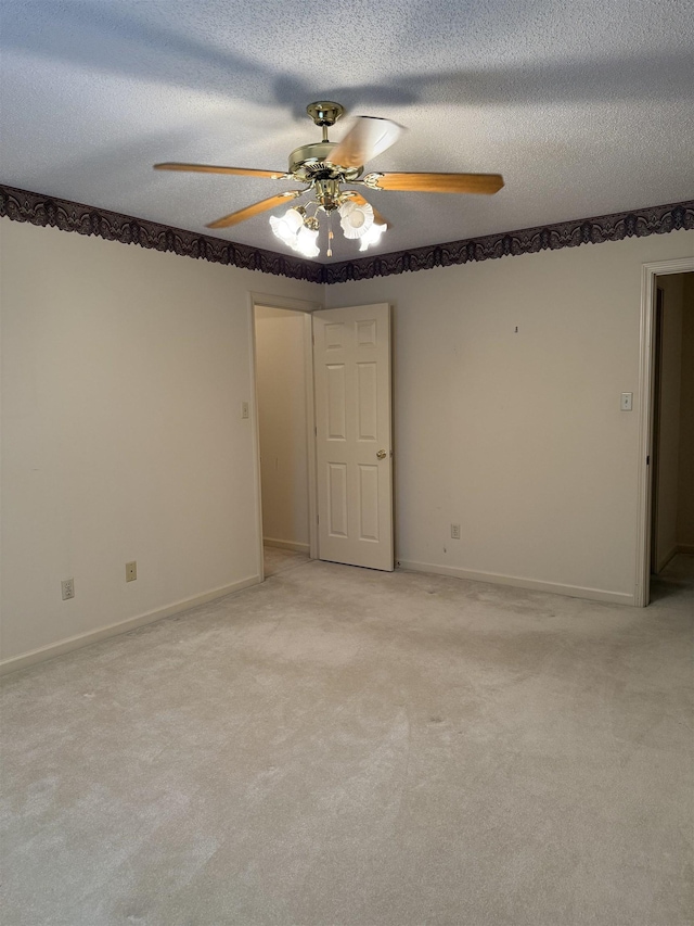 917 Valleyview Ln, Collierville, TN 38017 - spare room featuring a ceiling fan, light colored carpet, a textured ceiling, and baseboards