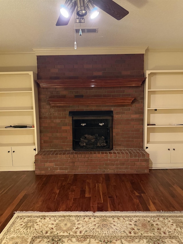 917 Valleyview Ln, Collierville, TN 38017 - unfurnished living room with ornamental molding, a fireplace, wood finished floors, a ceiling fan, and a textured ceiling