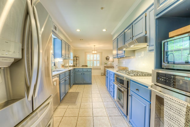 7352 Magnolia Ridge Dr, Germantown, TN 38138 - kitchen featuring appliances with stainless steel finishes, under cabinet range hood, ornamental molding, a sink, and light countertops