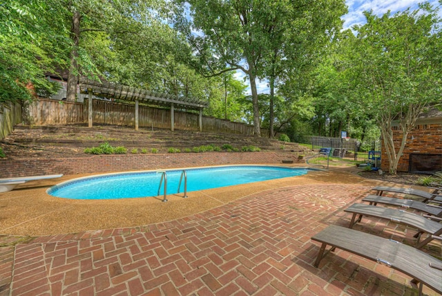 7352 Magnolia Ridge Dr, Germantown, TN 38138 - view of swimming pool featuring a diving board, a fenced backyard, a patio area, and view of scattered trees