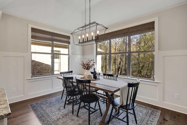125 Magnolia Park Dr, Rossville, TN 38066 - dining area featuring a decorative wall, a wainscoted wall, a chandelier, dark wood-style flooring, and ornamental molding