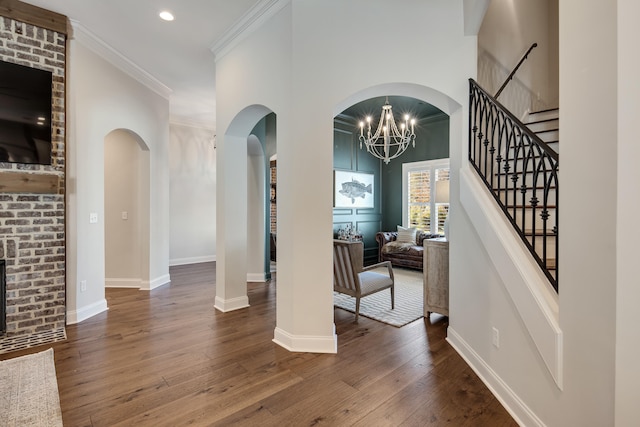 125 Magnolia Park Dr, Rossville, TN 38066 - foyer entrance featuring hardwood / wood-style floors, ornamental molding, stairs, baseboards, and arched walkways