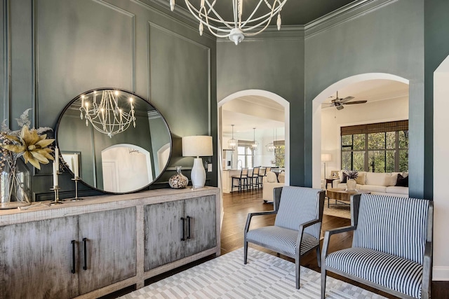125 Magnolia Park Dr, Rossville, TN 38066 - living area with a chandelier, arched walkways, plenty of natural light, and ornamental molding