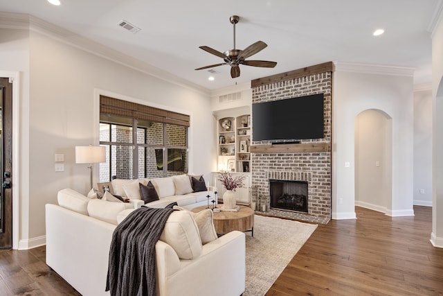 125 Magnolia Park Dr, Rossville, TN 38066 - living room featuring a ceiling fan, arched walkways, recessed lighting, ornamental molding, and baseboards