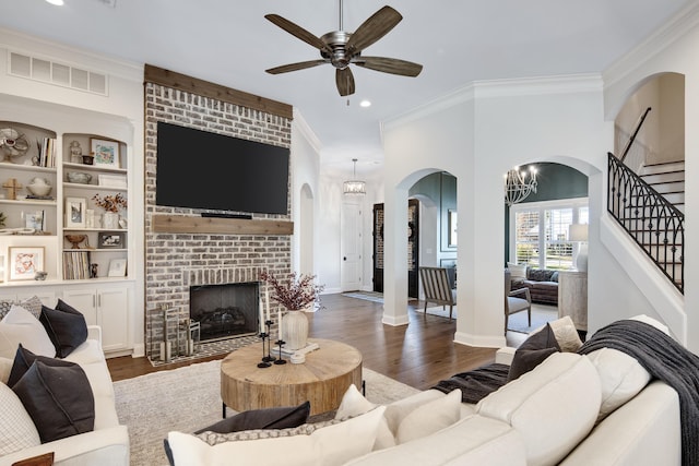 125 Magnolia Park Dr, Rossville, TN 38066 - living area featuring arched walkways, ceiling fan, ornamental molding, a brick fireplace, and recessed lighting