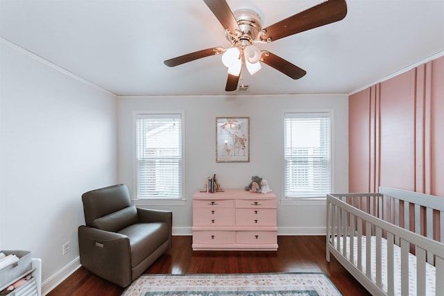 470 N Highland St, Memphis, TN 38122 - bedroom featuring dark wood-style floors, a nursery area, baseboards, crown molding, and ceiling fan
