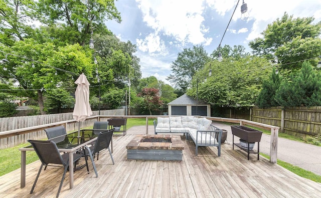 470 N Highland St, Memphis, TN 38122 - deck with outdoor dining area, an outdoor living space with a fire pit, and a fenced backyard