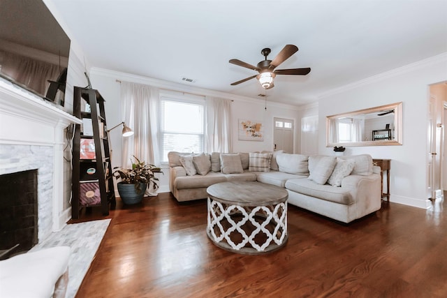 470 N Highland St, Memphis, TN 38122 - living room with dark wood-style floors, a ceiling fan, a fireplace, ornamental molding, and baseboards