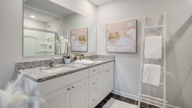 4494 Royster Creek Dr, Millington, TN 38053 - full bath featuring double vanity, baseboards, an enclosed shower, and tile patterned flooring