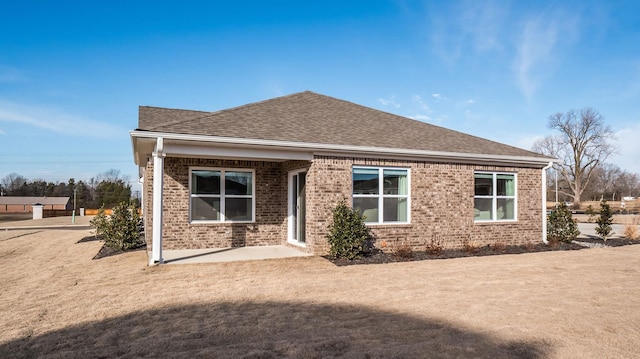 4494 Royster Creek Dr, Millington, TN 38053 - rear view of house with brick siding and a shingled roof