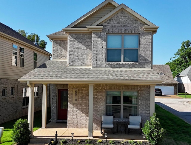 5510 Rams Horn Dr, Millington, TN 38053 - view of front of property featuring covered porch, brick siding, and roof with shingles