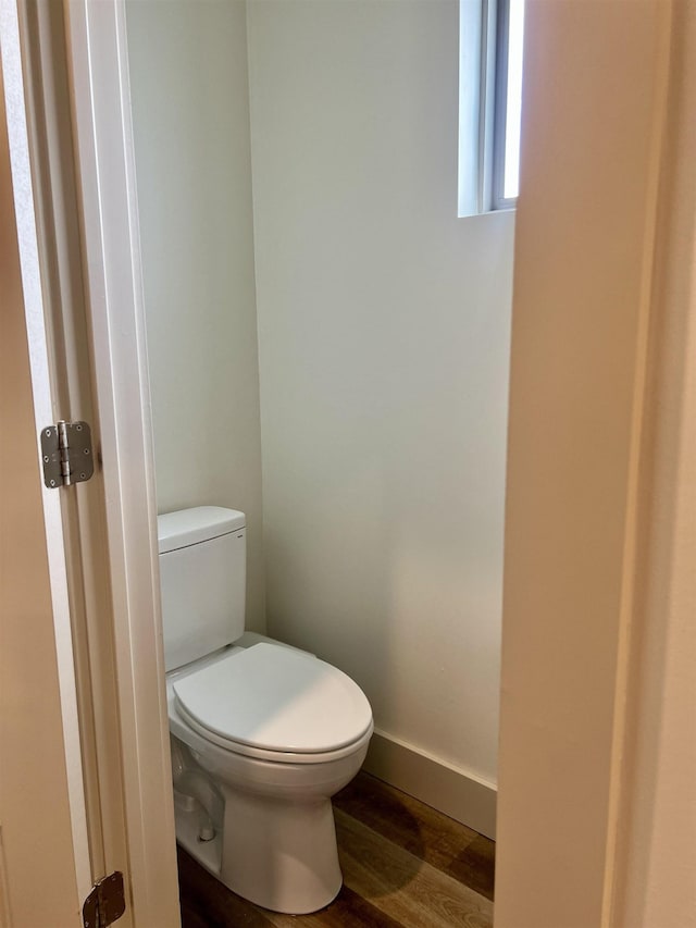 5510 Rams Horn Dr, Millington, TN 38053 - bathroom with toilet, wood finished floors, and baseboards
