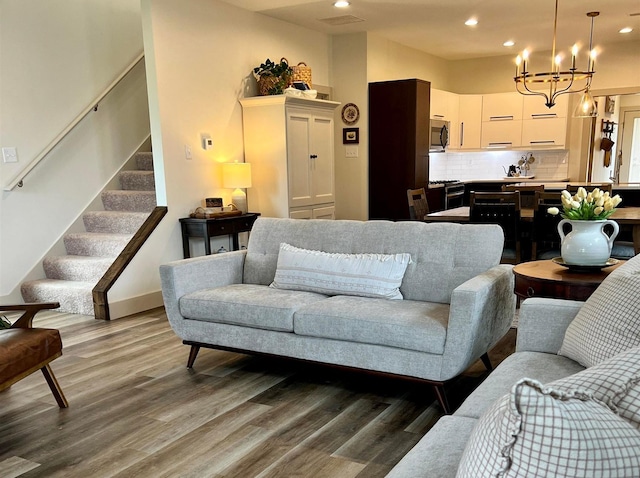 5510 Rams Horn Dr, Millington, TN 38053 - living room with a chandelier, wood finished floors, recessed lighting, stairs, and baseboards