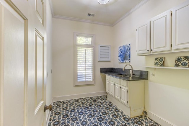 9200 Forest Hill Ln, Germantown, TN 38139 - laundry room featuring a sink, baseboards, crown molding, and tile patterned floors