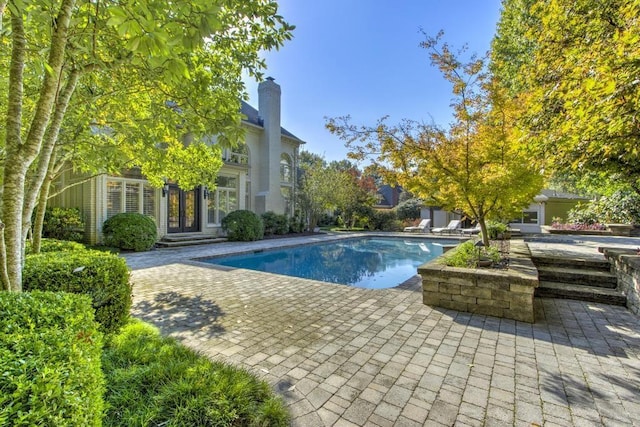 9200 Forest Hill Ln, Germantown, TN 38139 - outdoor pool with french doors and a patio area