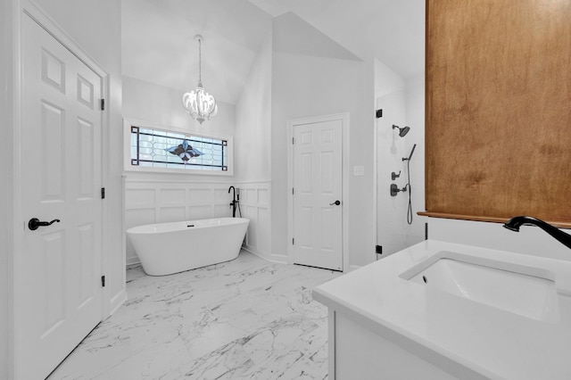 8955 Clair Douwie Cv, Bartlett, TN 38133 - bathroom with marble finish floors, a freestanding bath, a chandelier, vanity, and a shower