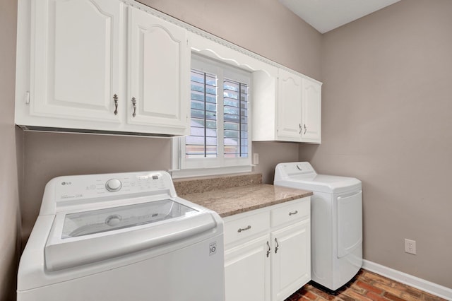 8955 Clair Douwie Cv, Bartlett, TN 38133 - laundry room with cabinet space, baseboards, and washing machine and clothes dryer